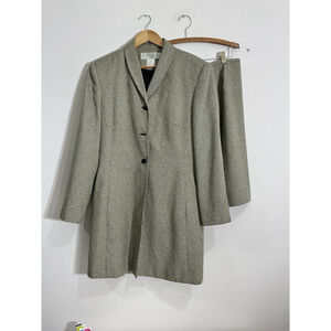 Chic Women's Black and cream 2 piece suit with long jacket and skirt.